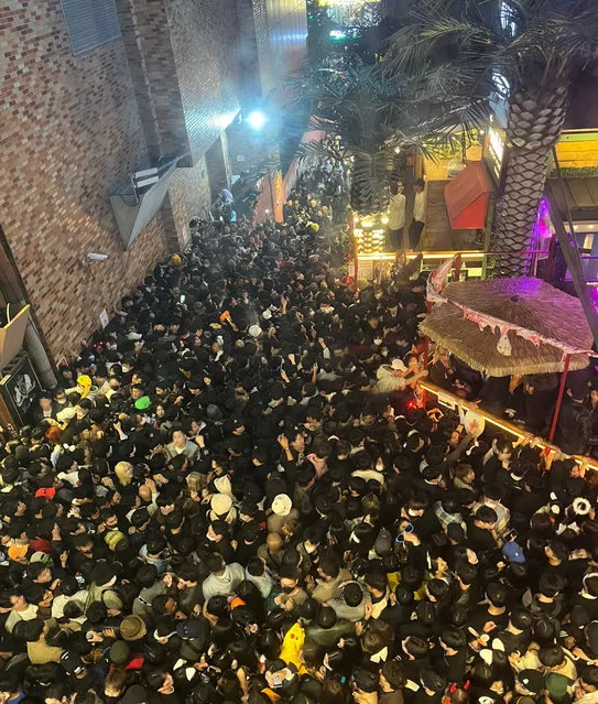 A street in Itaewon district is pictured full of people before a stampede during Halloween festivities killed and injured many in Seoul, South Korea, in this image released by Yonhap on October 30, 2022. (Photo by Yonhap via Reuters)