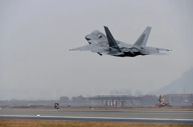 A U.S. Air Force F-22 Raptor takes off from a South Korean air base in Gwangju, South Korea, Monday, December 4, 2017. The United States and South Korea have started their biggest-ever joint air force exercise with hundreds of aircrafts including two dozen stealth jets. (Photo by Yonhap via AP Photo)