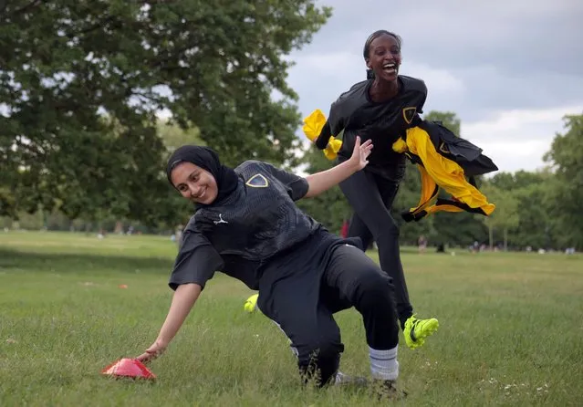 Yasmin Abdullahi, 30, Founder of Sisterhood FC, chases her team mate Assma Asif, 25, during a training session in Hyde Park, in London, Britain on June 6, 2021. (Photo by Hannah McKay/Reuters)