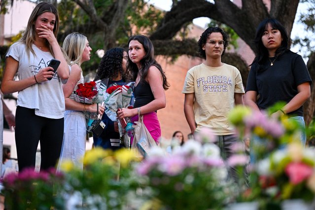 Students hold a vigil near the scene of a shooting near the Florida State University student center on April 17, 2025 in Tallahassee, Florida. According to reports, two people were killed and several others injured when the alleged shooter, believed to be a current student and the son of a Leon County sheriff's deputy, opened fire on the university's main campus. (Photo by Miguel J. Rodriguez Carrillo/Getty Images)