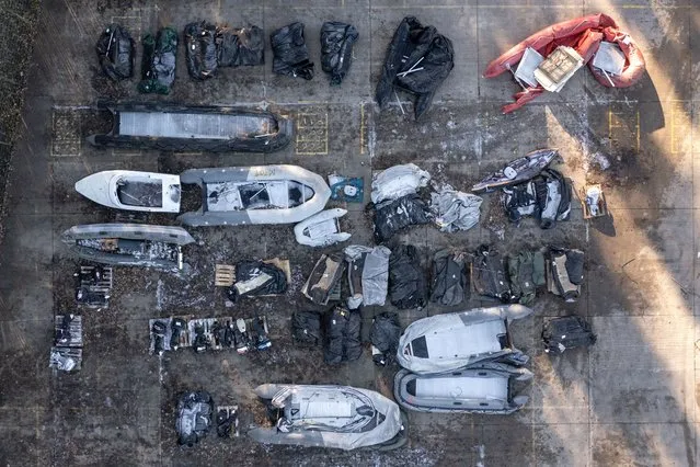 Inflatable craft and boat engines used by migrants to cross the channel are stored in a Home Office facility on December 15, 2022 in Dover, England. Four people died, and 39 were rescued, after a packed boat with migrants sank in the English Channel yesterday. A search continues for four more people believed to be missing. (Photo by Dan Kitwood/Getty Images)
