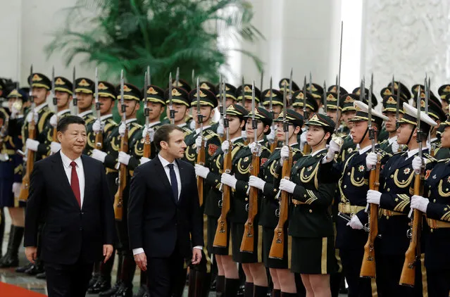 French President Emmanuel Macron and Chinese President Xi Jinping review the guard of honour during a welcoming ceremony at the Great Hall of the People in Beijing, China January 9, 2018. (Photo by Thomas Peter/Reuters)
