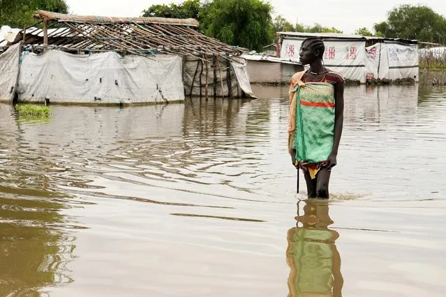 A girl walks in water in the town of Pibor, Boma state, South Sudan, November 6, 2019. (Photo by Andreea Campeanu/Reuters)