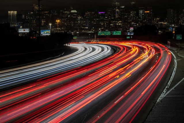 Car traffic is seen during rush hour in downtown San Francisco, California on July 30, 2025. (Photo by Carlos Barria/Reuters)
