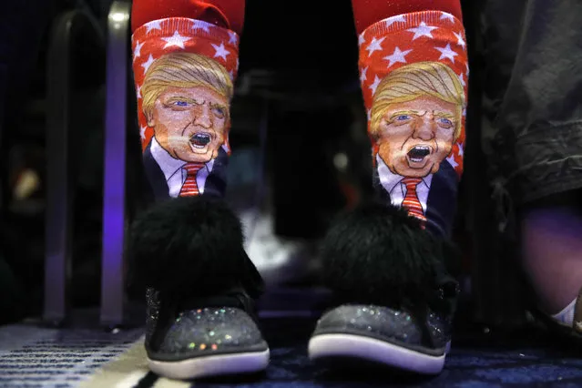 Millie March, 12, of Fairfax, Va., wears socks featuring President Donald Trump while awaiting his speech to the Conservative Political Action Conference (CPAC), at National Harbor, Md., Friday, February 23, 2018. (Photo by Jacquelyn Martin/AP Photo)