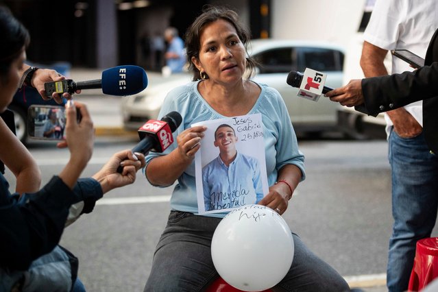 The mother of Jesus Gabriel Jimenez, Sorangel Arguinzones, talks to the media during a vigil of family members in Caracas, Venezuela, 16 July 2025. A group of women, relatives of young people detained in the context of the crisis following last July's 2024 presidential elections in Venezuela, requested a meeting with the Attorney General, Tarek William Saab, to “directly present' the cases of their relatives and to know the reasons why, they claim, the releases have been 'paralyzed since March”. (Photo by Ronald Pena R./EPA)