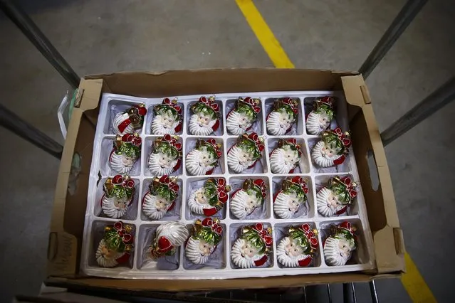 Santa Clause shape decorations are stored in a box at the Silverado manufacture of hand-blown Christmas ornaments in the town of Jozefow outside Warsaw December 2, 2014. (Photo by Kacper Pempel/Reuters)