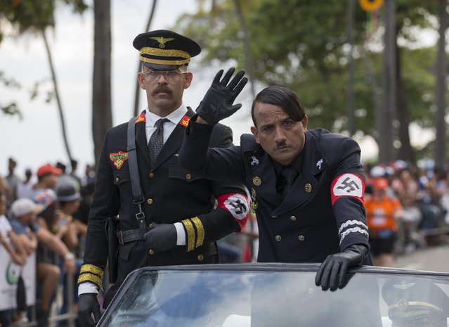 People wearing costumes resembling Adolf Hitler and Nazi officials participate during the 2018 National Carnival Parade on the boardwalk of Santo Domingo, Dominican Republic, 04 March 2018. (Photo by Orlando Barria/EPA/EFE)