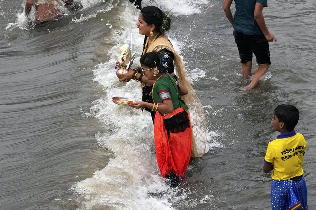 A fishermen community celebrates the Hindu festival Narli Poornima, a coconut festival at the sea shore in Mumbai, India, Friday, August 8, 2025. (Photo by Rajanish Kakade/AP Photo)