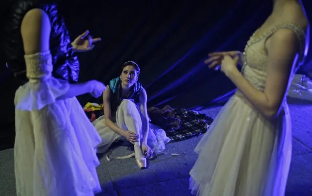 The Imperial Russian Ballet members wait to perform Tchaikovsky's “Swan Lake” at Arena hall in central Bosnian town of Zenica December 7, 2014. (Photo by Dado Ruvic/Reuters)