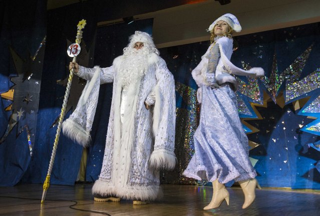 People dressed as Father Frost, the equivalent of Santa Claus, and Snow Maiden take part in the contest “Yolka-fest-2014” (Fir-festival-2014) in Minsk December 12, 2014. (Photo by Vasily Fedosenko/Reuters)