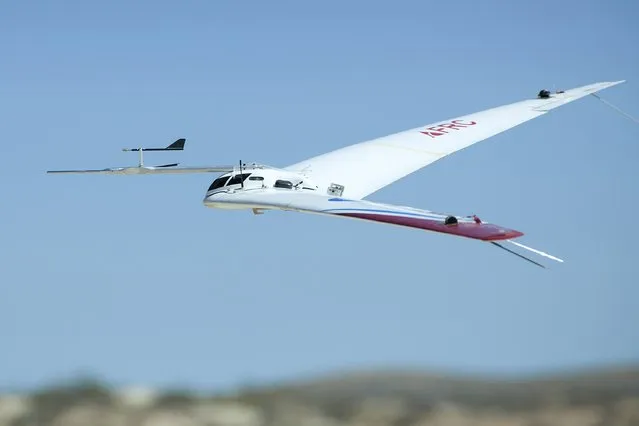 A complex aircraft called the Preliminary Research Aerodynamic Design to Lower Drag, or Prandtl-D, is seen in a NASA handout picture during a test flight at Armstrong Flight Research Center in Edwards, California October 28, 2015. Resembling a boomerang, the aircraft features a new method for determining the shape of the wing with a twist that could lead to an 11-percent reduction in fuel consumption, according to a NASA news release. (Photo by Ken Ulbrich/Reuters/NASA)