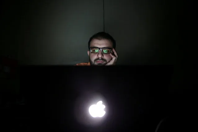 Director Humam Husari edits his film after finishing the filming phase at his office in the rebel held Douma neighbourhood of Damascus, Syria October 5, 2016. (Photo by Bassam Khabieh/Reuters)