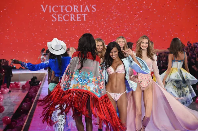 Models including Gracie Carvalho from Brazil and Sanne Vloet from The Netherlands walk the runway during the 2015 Victoria's Secret Fashion Show at Lexington Avenue Armory on November 10, 2015 in New York City. (Photo by Dimitrios Kambouris/Getty Images for Victoria's Secret)