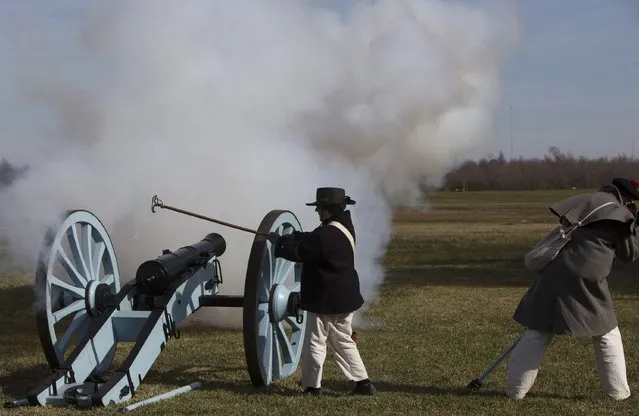 Reenactors playing the roll of British artillerymen fire a cannon during a commemoration of the Battle of New Orleans in the War of 1812, marking its  bicentennial in Chalmette, Louisiana January 10, 2015. (Photo by Lee Celano/Reuters)