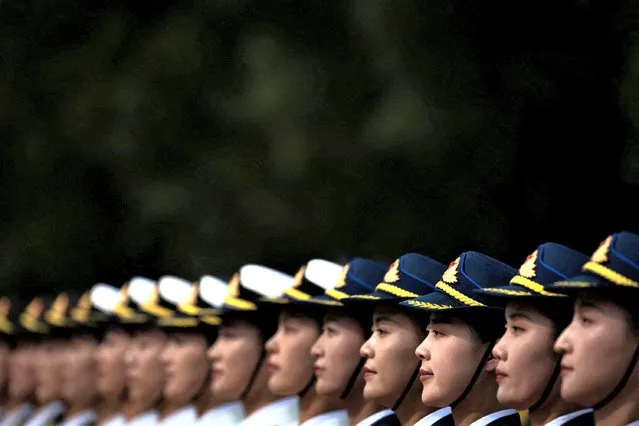 Female soldiers of the honour guard stand in formation during a welcoming ceremony for Democratic Republic of Congo's President Felix Tshisekedi at the Great Hall of the People in Beijing, China on May 26, 2023. (Photo by Thomas Peter/Pool via Reuters)