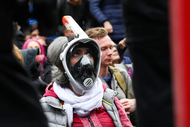 A demonstrator attends a protest against the government's coronavirus disease (COVID-19) restrictions, near the Reichstag, the seat of Germany's lower house of parliament Bundestag, in Berlin, November, 18, 2020. (Photo by Christian Mang/Reuters)