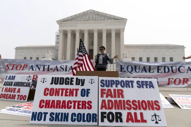 A person protests outside of the Supreme Court in Washington, Thursday, June 29, 2023. The Supreme Court on Thursday struck down affirmative action in college admissions, declaring race cannot be a factor and forcing institutions of higher education to look for new ways to achieve diverse student bodies. (Photo by Jose Luis Magana/AP Photo)
