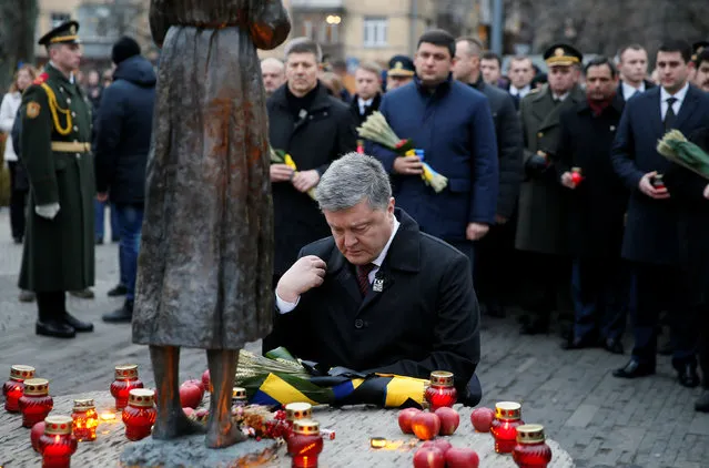 Ukraine's President Petro Poroshenko visits a monument to Holodomor victims during a commemoration ceremony marking the 83rd anniversary of the famine of 1932-33 in which millions died of hunger, in Kiev, Ukraine, November 26, 2016. (Photo by Valentyn Ogirenko/Reuters)