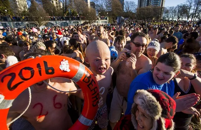 Participants prepare to run into English Bay during the 96th annual New Year's Day Polar Bear Swim in Vancouver, British Columbia January 1, 2016. (Photo by Ben Nelms/Reuters)