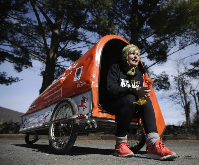 Sixty-eight year old cross-country runner Rosie Swale-Pope is interviewed while sitting in her cart, “The Icebird”, in Upperville, Virginia March 13, 2015. (Photo by Gary Cameron/Reuters)