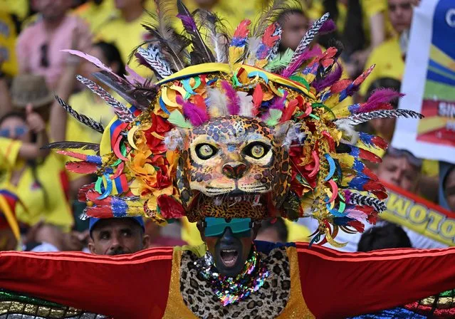 A supporter of Colombia cheers before the 2026 FIFA World Cup South American qualification football match between Colombia and Uruguay at the Roberto Melendez Metropolitan Stadium in Barranquilla, Colombia, on October 12, 2023. (Photo by Raul Arboleda/AFP Photo)