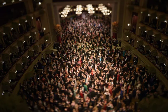 A picture taken with a Tilt/Shift lens shows guests waltzing during the opening ceremony of the traditional 60th Vienna Opera Ball at the Wiener Staatsoper (Vienna State Opera) in Vienna, Austria, 04 February 2016. (Photo by Christian Bruna/EPA)