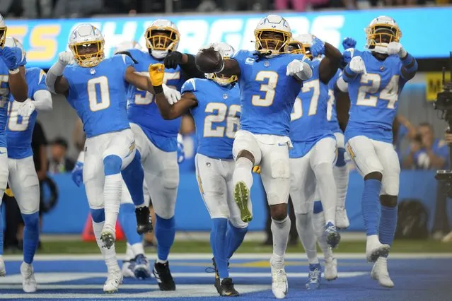 Los Angeles Chargers safety Derwin James Jr. (3) celebrates his interception with teammates during the second half of an NFL football game against the Chicago Bears, Sunday, October 29, 2023, in Inglewood, Calif. (Photo by Ashley Landis/AP Photo)