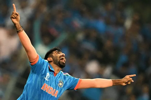 India's Jasprit Bumrah celebrates after taking the wicket of Sri Lanka's Pathum Nissanka during the 2023 ICC Men's Cricket World Cup one-day international (ODI) match between India and Sri Lanka at the Wankhede Stadium in Mumbai on November 2, 2023. (Photo by Punit Paranjpe/AFP Photo)
