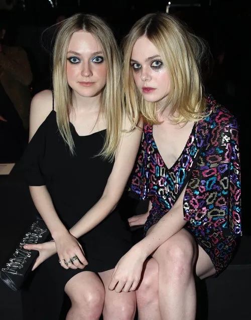 Elle Fanning, right, and Dakota Fanning attend Saint Laurent at the Palladium on Wednesday, February 10, 2016 in Los Angeles. (Photo by Matt Sayles/Invision/AP Photo)