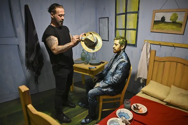 Painter Murat Karabuyuk creates Vincent van Gogh's “Bedroom in Arles” in three-dimensions, and also draws the famous Dutch painter's self-portrait on his student's face with the “human painting” technique in Ankara, Turkiye on October 21, 2023. (Photo by Dogukan Keskinkilic/Anadolu via Getty Images)