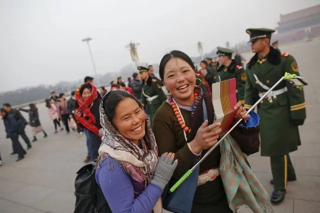 People leave Tiananmen Square shortly after a flag-raising ceremony as the area near the Great Hall of the People is prepared for upcoming annual sessions of the National People's Congress (NPC) and Chinese People's Political Consultative Conference (CPPCC) in Beijing March 3, 2016. (Photo by Damir Sagolj/Reuters)