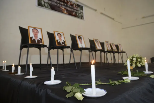 Framed photographs of seven crew members are displayed at a memorial service held by an association of Ethiopian airline pilots, in Addis Ababa, Ethiopia Monday, March 11, 2019. Authorities in Ethiopia, China and Indonesia grounded all Boeing 737 Max 8 aircraft Monday following the crash of an Ethiopian Airlines jetliner that killed 157 people, and investigators found the flight recorders from the field where the plane went down. (Photo by Samuel Habtab/AP Photo)