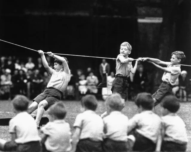 Britain's Prince Charles, center left, takes part in a sports day at Hill House School, in London, July 8, 1957. King Charles III hasn’t even been crowned yet, but his name is already etched on the walls of Hill House School in London. A wooden slab just inside the front door records Nov. 7, 1956, as the day the future king enrolled at Hill House alongside other notable dates in the school’s 72-year history. (Photo by AP Photo, File)