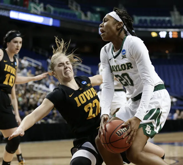 Baylor's Juicy Landrum (20) runs into Iowa's Kathleen Doyle (22) during the first half of a regional final women's college basketball game in the NCAA Tournament in Greensboro, N.C., Monday, April 1, 2019. (Photo by Gerry Broome/AP Photo)