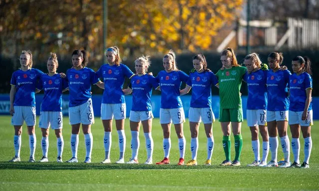 Everton and Manchester United players take part in a silence for Remembrance Sunday ahead of the Barclays FA Women's Super League match between Everton Women and Manchester United Women at Walton Hall Park on November 14, 2021 in Liverpool, England. (Photo by Emma Simpson – Everton FC/Everton FC via Getty Images)