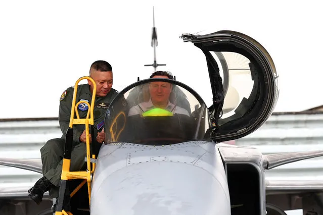 British Foreign Secretary and former Prime Minister David Cameron talks to a pilot as he sits in the cockpit of a Gripen fighter jet on the sidelines of an interview with Reuters at an Air Force Base in Nakhon Ratchasima province, Thailand on March 20, 2024. (Photo by Athit Perawongmetha/Reuters)