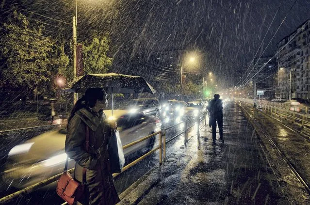 “Bucharest, Turda Blvd., 41 tram station. As the weather got worse in the evening, I hesitated to use my camera but suddenly I've spotted something interesting, the first snow of the year”. (Photo and caption by Vlad Eftenie/2014 Sony World Photography Awards)