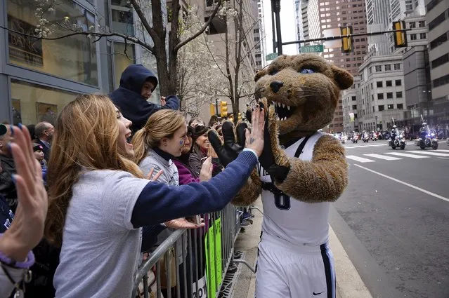 A crowd greets the Villanova mascot during a victory parade after they won the NCAA U.S. college basketball championship over North Carolina, in Philadelphia, Pennsylvania April 8, 2016. (Photo by Charles Mostoller/Reuters)