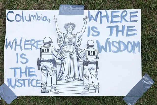 A sign is posted on the lawn of the protest encampment at Columbia University where students continue to protest in support of Palestinians, during the ongoing conflict between Israel and the Palestinian Islamist group Hamas, in New York City, April 23, 2024. (Photo by Caitlin Ochs/Reuters)