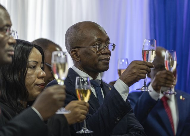 Michel Patrick Boisvert, who was named interim prime minister by the cabinet of outgoing Prime Minister Ariel Henry, toasts during the swearing-in ceremony of the transitional council tasked with selecting a new prime minister and cabinet, in Port-au-Prince, Haiti, April 25, 2024. (Photo by Ramon Espinosa/AP Photo)
