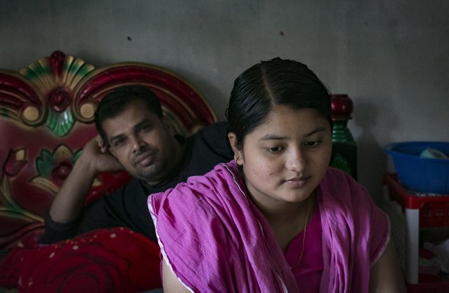 Meghla sits with her husband Liton on March 7, 2017 in Khulna division, Bangladesh. (Photo by Allison Joyce/Getty Images)