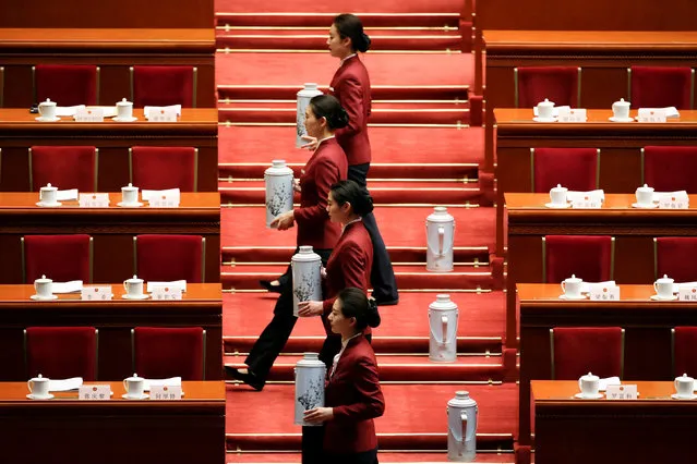 Attendants prepare ahead of the opening session of the National People's Congress (NPC) at the Great Hall of the People in Beijing, China, March 5, 2017. (Photo by Jason Lee/Reuters)
