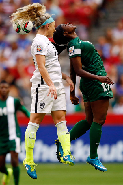 United States defender Julie Johnston (19) and Nigeria forward Courtney Dike (10) reach for a header in Vancouver, June 16, 2015. (Photo by Michael Chow/USA TODAY Sports)