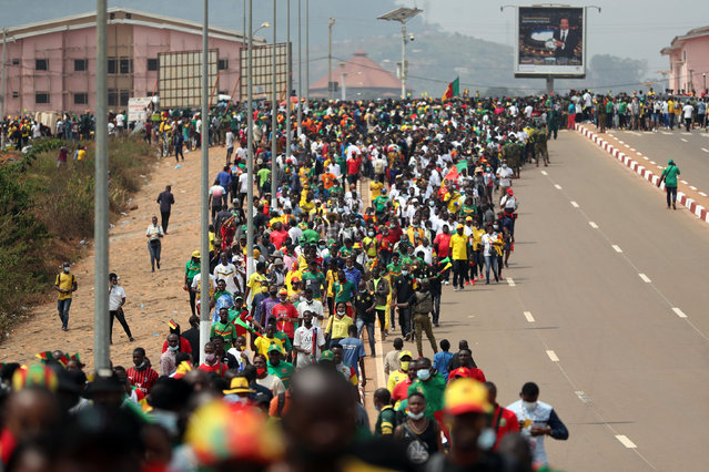 Cameroon fans outside the Olembe stadium before the first match of the Africa Cup of Nations football tournament in Yaoundé, Cameroon on January 9, 2022. Cameroon is hosting the competition and will play Burkina Faso in the opening match. (Photo by Mohamed Abd El Ghany/Reuters)