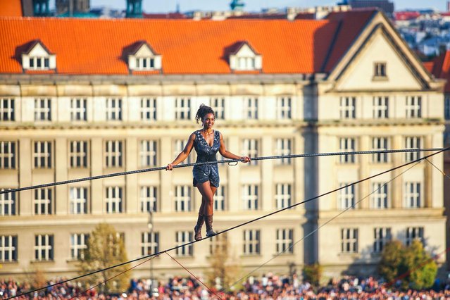 Tatiana-Mosio Bongonga from the French troup Cie Basinga Wednesday, August 14, 2019 crossed the Vltava River on a 350-meter-long rope at the height of 35 meters in Prague, Czechia. She crossed the river without any visible protection, using a four-metre-long balance pole weighing 12 kg. The whole journey took her about 40 minutes. (Photo by Xinhua News Agency/Rex Features/Shutterstock)