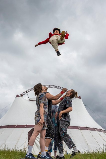 Acrobats from the Revel Puck Circus showed off The Nose Dive Assembly at the Queen Elizabeth Olympic Park in east London on Thursday, May 30, 2024. The show includes high-wire walkers and the only female Wheel of Death duo in the UK. It  moves to Gosport in Hampshire next month and finishes on the Isle of Wight in July. (Photo by Stephen Chung/Alamy Live News)