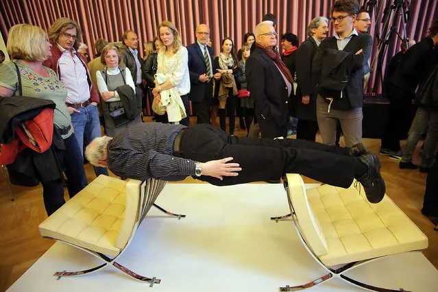 Visitor performes during the Erwin Wurm “One Minute Sculpture Exhibition”, at the Staedel Museum on May 6, 2014 in Frankfurt am Main, Germany. (Photo by Hannelore Foerster/Getty Images)