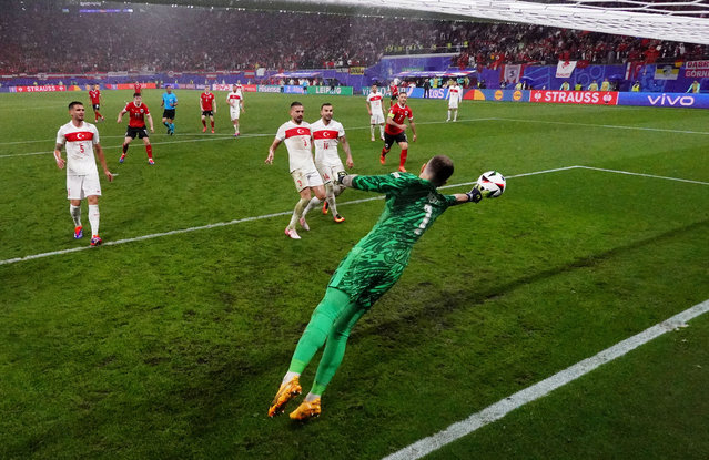 Mert Gunok of Turkiye saves the headed shot of Christoph Baumgartner of Austria (not pictured) during the UEFA EURO 2024 round of 16 match between Austria and Turkiye at Football Stadium Leipzig on July 02, 2024 in Leipzig, Germany. (Photo by Dan Mullan/Getty Images)