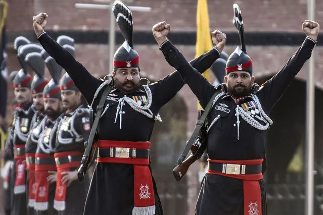Pakistani Rangers take part in the beating retreat ceremony at the India-Pakistan Wagah border post, about 35 km from Amritsar on March 9, 2022. (Photo by Narinder Nanu/AFP Photo)